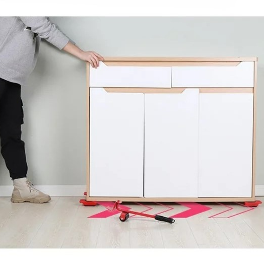 Image of man sliding furniture on MoverHero