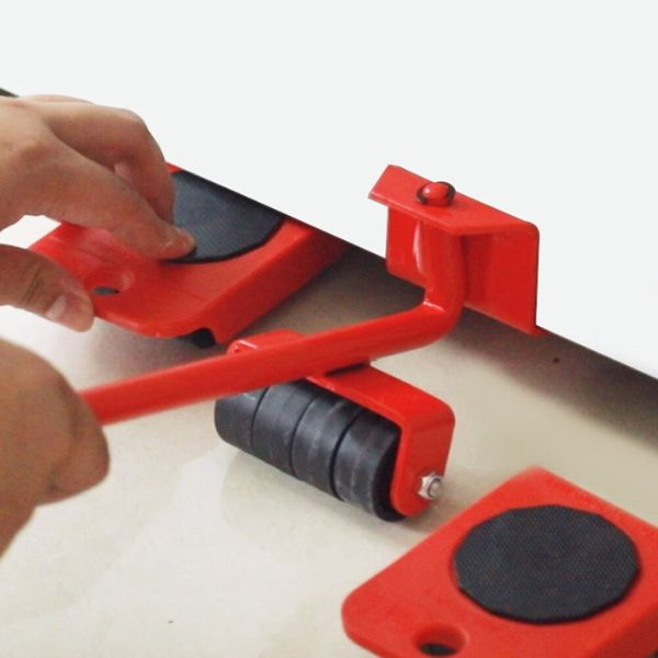 Image of a user placing the wheels underneath a piece of furniture, using the crowbar to lift it